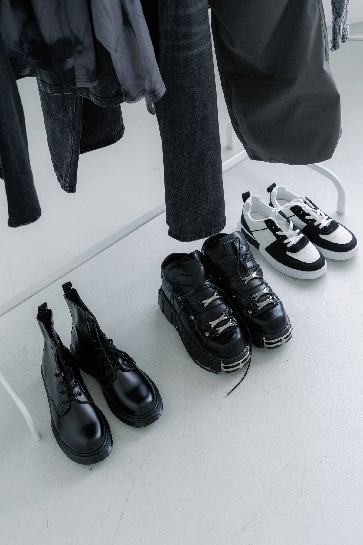 Rack of Clothing and Shoes in a Studio